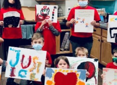 Kids holding signs