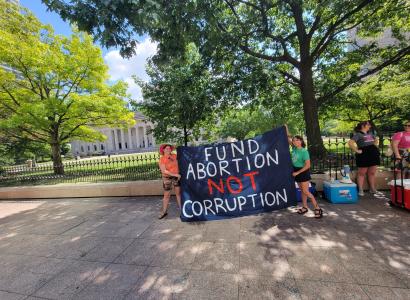 Sign saying Fund Abortion not Corruption