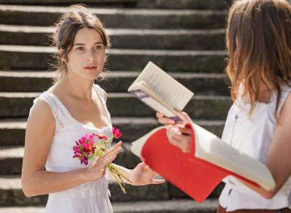 Young woman interacting with another young woman