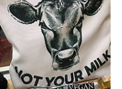White T-shirt with big cow face in the middle and words Not Your Mom, Not Your Milk