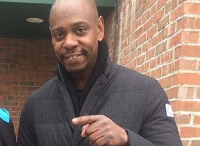 Black man pointing to the left