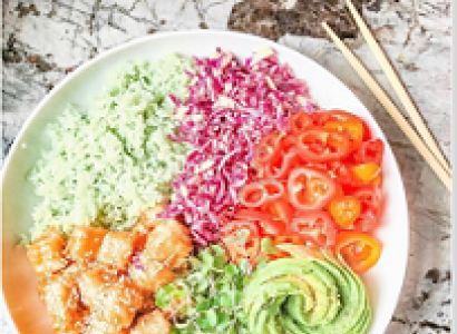 Plate of very brightly colorful food - green, purple, orange, red, yellow