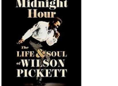 Book cover, black bakground, photo of black man bending over with a mic to his mouth singing and arm swinging backwards and the words In the Midnight Hour the life & soul of Wilson Pickett by Tony Fletcher 