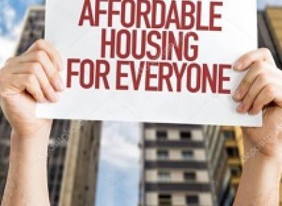 Drawing of two hands holding up a sign saying Affordable Housing for Everyone and a big building in the background