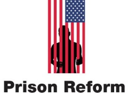 A flag hanging sideways and a silhouette of a man behind the red stripes as if they are bars and the words Prison Reform at the bottom