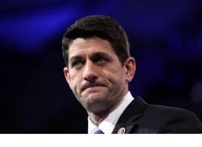 Blue background and head and shoulders of white man with black hair biting him lips as if he's upset