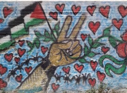 Peace sign and Palestinian flag surrounded by hearts