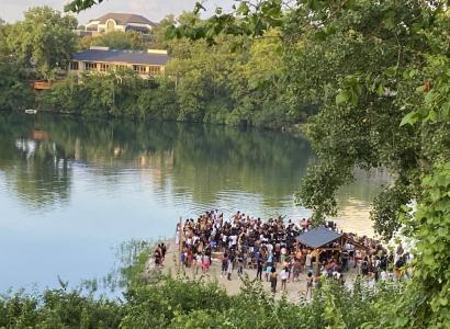 People gathered by a quarry
