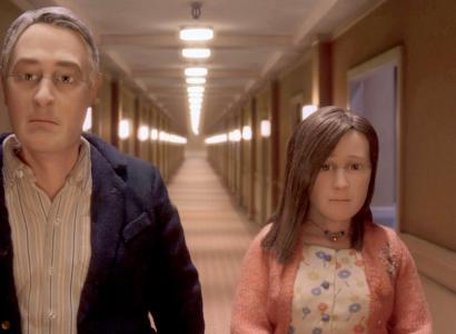 Man and woman walking down a hall