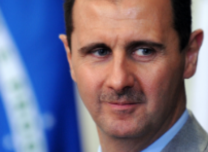 Middle aged white man with big ears closeup of face looking shifty