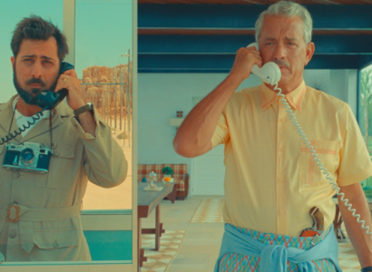 Two men each talking on a phone