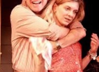 Man with arms around woman's neck from the back