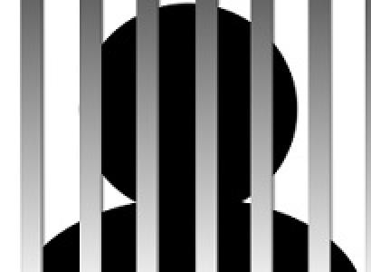 Black drawing of person behind bars