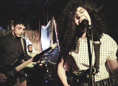 Woman singing and guy on guitar