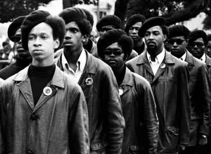Black Panthers in berets in black and white photo