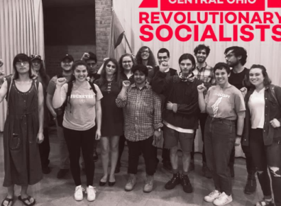 People posing in front of poster