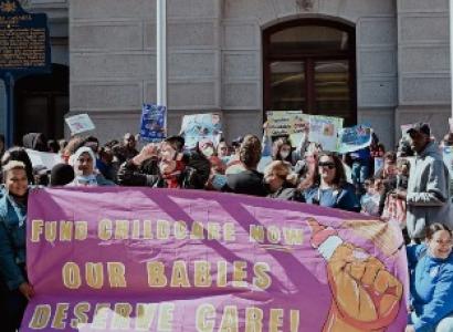Protest with sign Fund Childcare Now