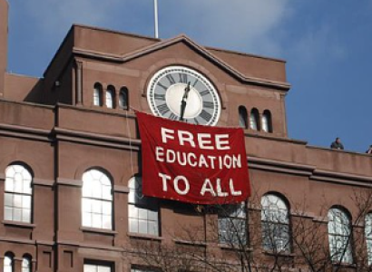 College building with sign Free Education to all