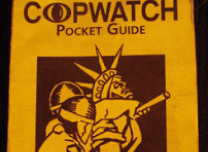 Yellow pamphlet with words Copwatch Pocket Guide at top and a drawing of two cops apprehending the Statue of Liberty