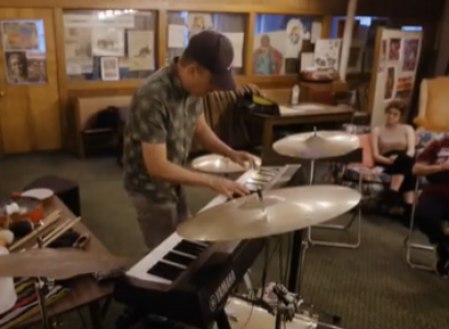 Man playing keyboards and drums