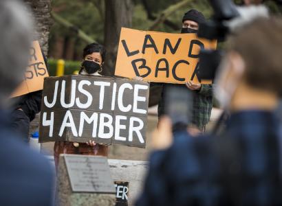 Protestors holding signs
