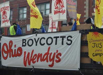 Big truck with signs to Boycott Wendy's at start of march down High Street