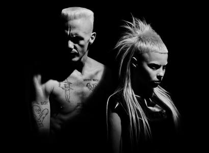 B/W photo of man and woman from band