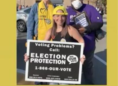 People posing with Election Protection sign