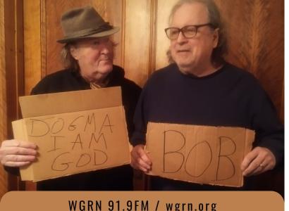 Dan and Bob holding signs with palindromes