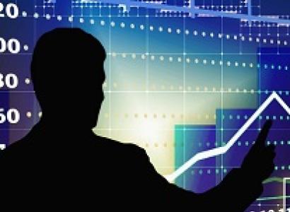 Black silhouette of the back of a man pointing to a bright blue graph that shows a line going up and down