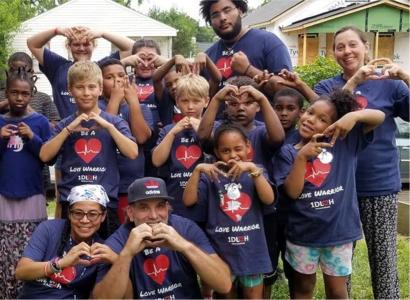 Kids making heart signs with their hands