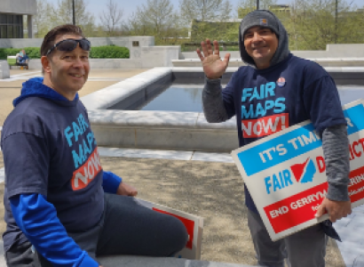 Guy with Fair Districts sign