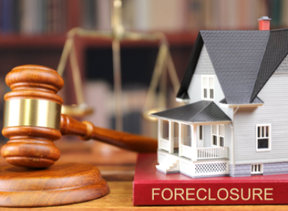 House, gavel and foreclosure sign
