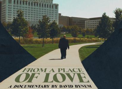 A heart with a man walking on a path and title of movie