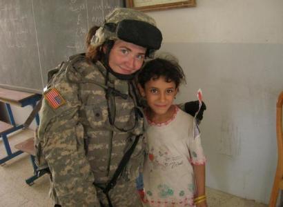 Female solider and little child