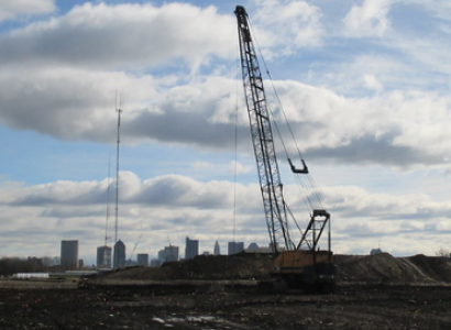 Crane over property with skyline in background
