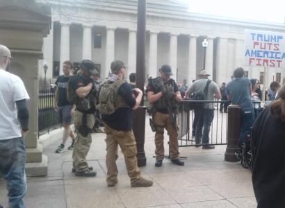 Guy with semi automatic guns at statehouse