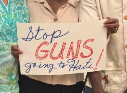 Sign saying Stop Guns going to Haiti