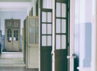 Hallway with lots of doors open