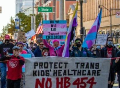 People holding sign and marching