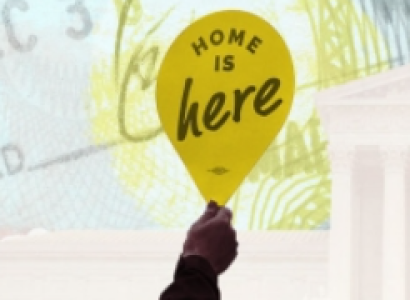 Sign saying Home is Here