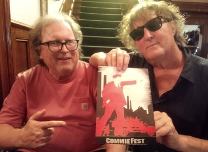 Bob and Dan showing a Comfest flyer