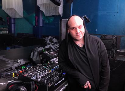 Man standing next to mixing board