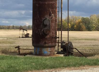 Tall metal structure out in a field - an injection well