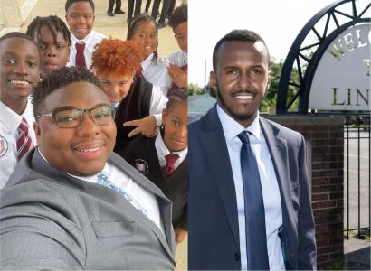 Two black men in suits smiling