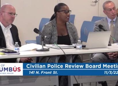 Three members of Civilian Review Board at a table