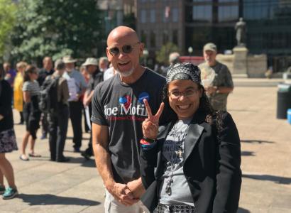 White guy and Latina woman smiling for the camera