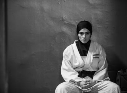 Person sitting in judo outfit