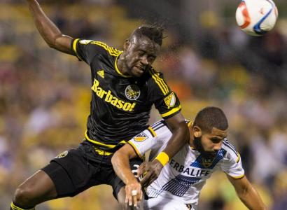 Kei Kamara (left) battles for a header against LA Galaxy defender Leonardo. (Photo courtesy of Crew SC)