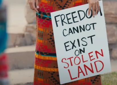 Sign saying Freedom Can't Exist on Stolen Land